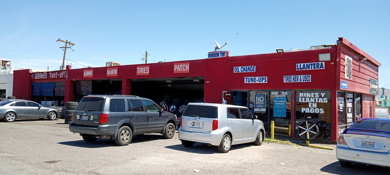 Charleston Tires full exterior showing all services painted on the building: brakes, tune-ups, alignment, balancing, tires, patch, oil change